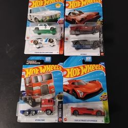 6 Hotwheels 1 optimus prime / 2 Batmobiles Rare caddy New in packages