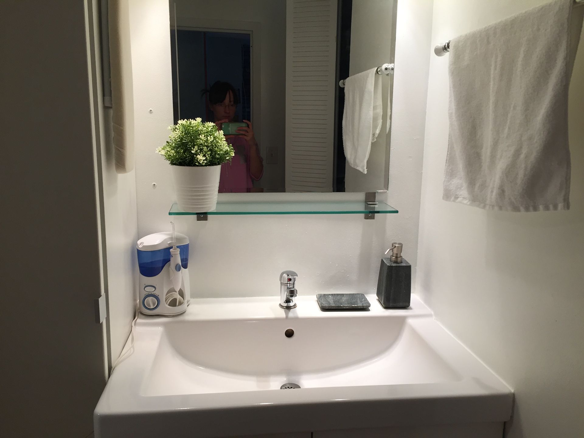 Bathroom mirror with glass shelf