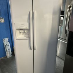 White Frigidaire side-by-side refrigerator 33 Inch Wide 