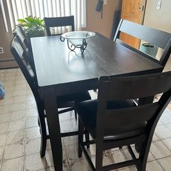 Kitchen Table With Four Leather Chairs And A Leather Bench 