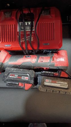 Milwaukee 2 battery's one 5.0 the other 8.0, rapid charger, and multi tool