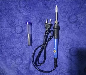 Soldering iron and solder