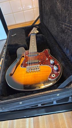2 separate Mini fender guitars