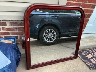 A new , black mirror (38” long x 37” high)