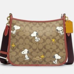 Brand new Coach Snoppy Peanuts Woodstock Print
purse