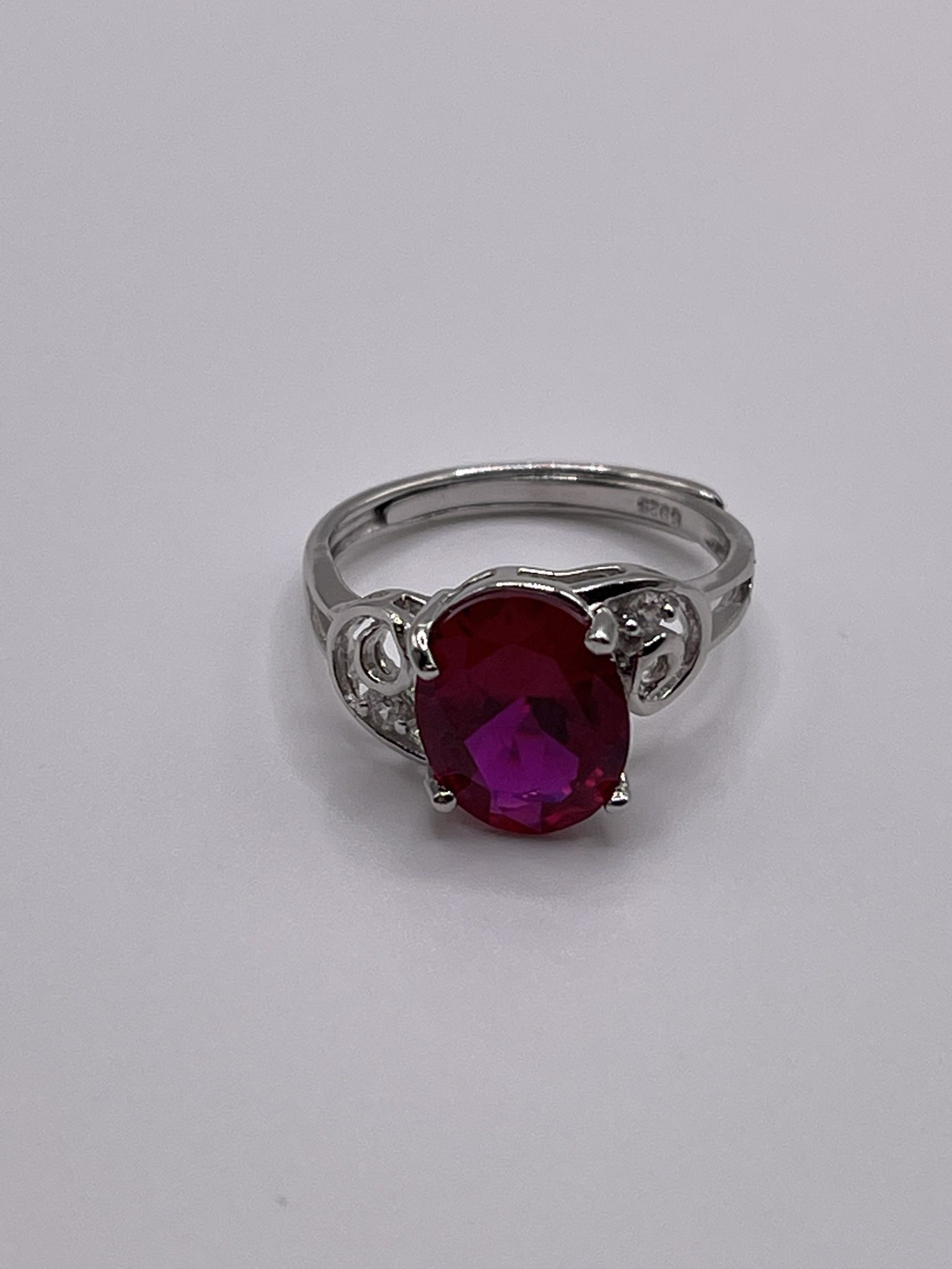 A lab created ruby ring on sterling silver with an adjustable band.