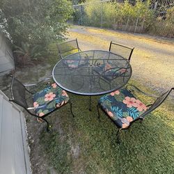 Wrought Iron Table And Four Match Chairs