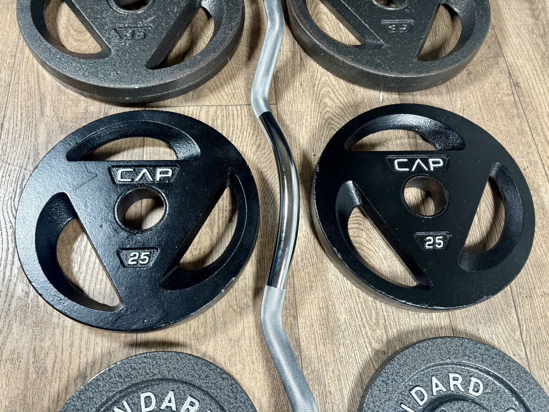 Olympic Equipment: Silver Curl Bar With Cooper Bearings & Weight Plates Pairs Of 35s, 25s And 10 Pounds (Total: 160 lbs)
