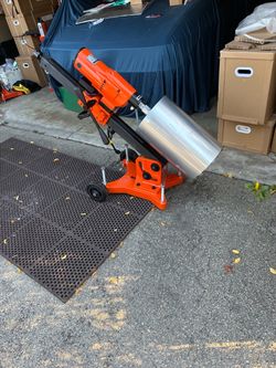 Large  concrete core drill able to drill at angle by adjust the bolts Will hold up to a. 11 inch bit $995