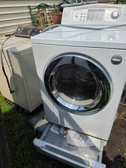 LG DRYER with shelf space at bottom. 3 PLUG