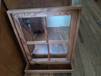 Hanging wood framed mirror with planter
