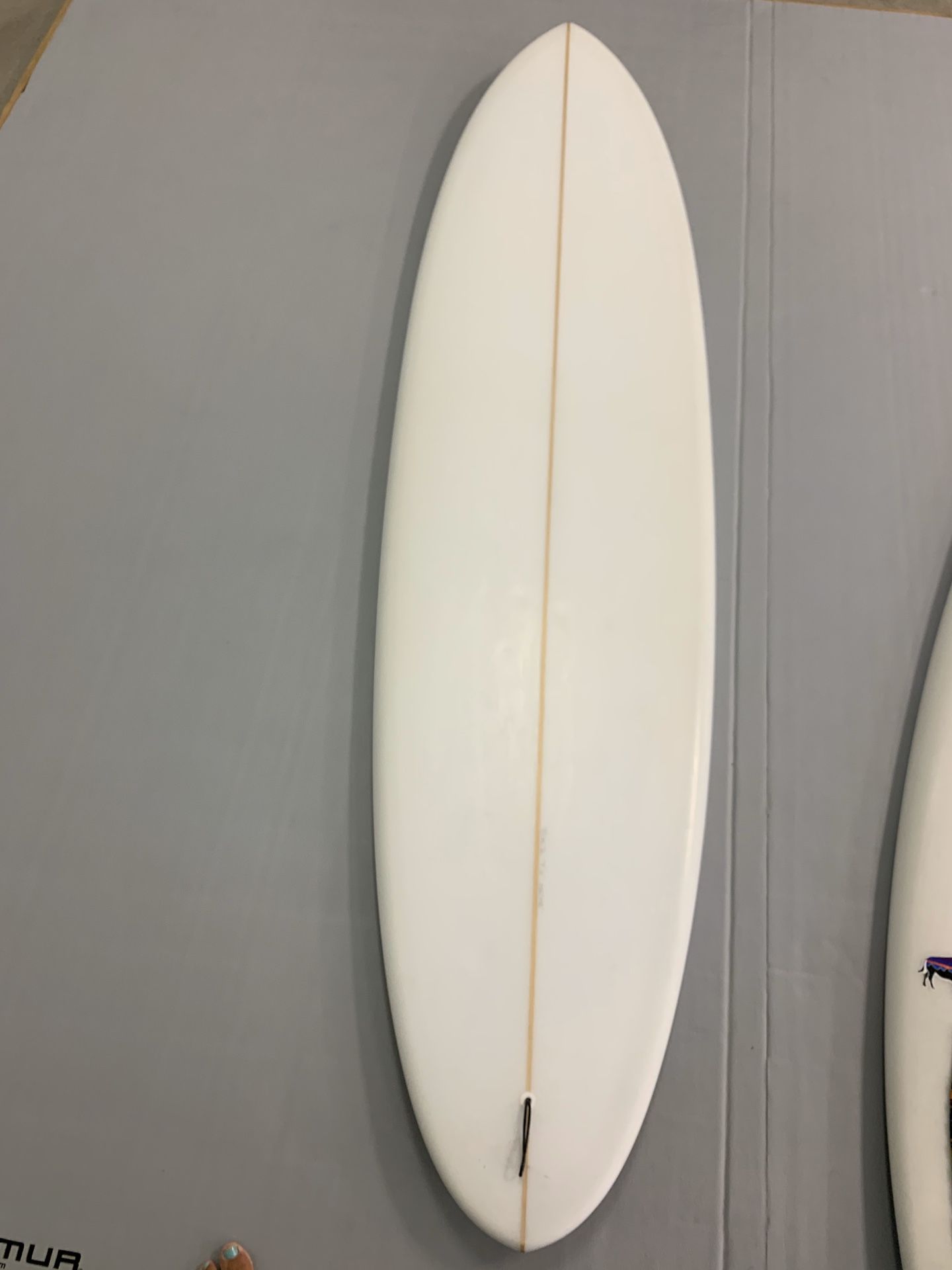 7’6 Mid-length single fin surfboard