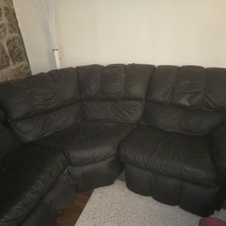 4-Piece Black Leather Sectional with Fold-Out Bed & Recliners

