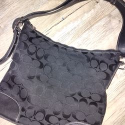 Coach purse with leather