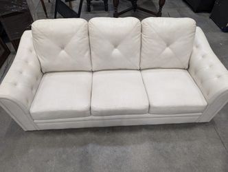 Light Beige Tufted Three-Seater Sofa