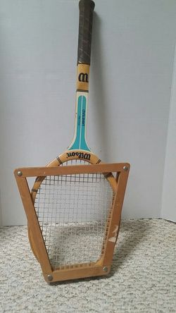 Tennis racquet with frame