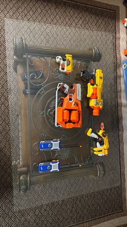 4 used Nerf pistols and walkie talkies