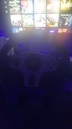 steering wheel, pedals, and shifter Gaming steering wheel, pedals, and shifter