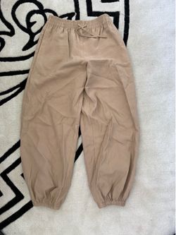 Tan high-waisted wide-leg trousers with elastic waistband and drawstring. Size: 9-10 #highwaisted #trousers #wideleg