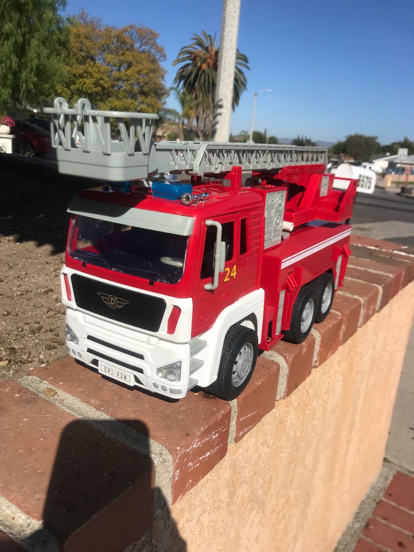 Driven fire truck moving parts lights & sounds like new