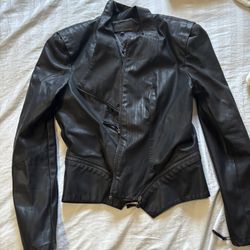Black leather jacket with zipper detail and inside pockets