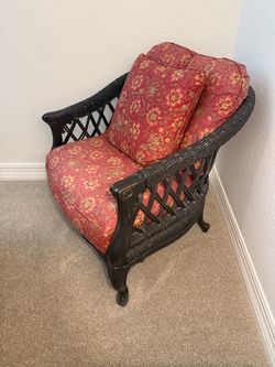Black Armchair with Floral Cushions
