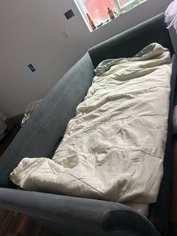 Gray Upholstered Twin bed with trundle