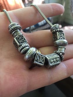 Silver Tone pandora style necklace and 14 charms