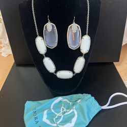 Kendra Scott white stone necklace and silver tone earrings
