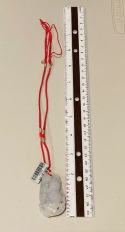 Jade peanut pendant on string necklace