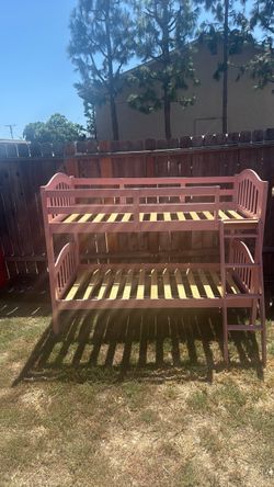 Pink wooden bunk bed