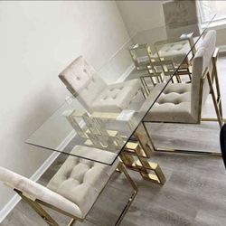 glass dining table with legs in gold