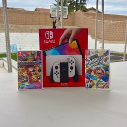 Nintendo Switch Oled with super Mario party and Mario kart deluxe 8 Floor Model Display 