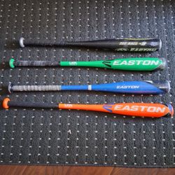 1 Tee Ball Bat.  3 Baseball Bats