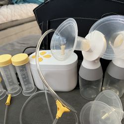 Medela Pump, Bottles , Flanges, Storage Bottles.