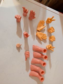 various miniature hand and foot finger puppets