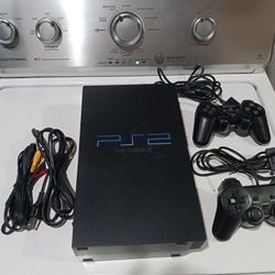 Play Station 2. it turns on, but doesn't read the disks.   2 controllers  and one game.