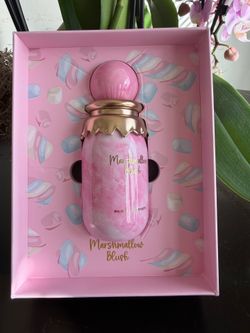 Decorative pink marbleized perfume bottle with gold accents. Gold lettering reads "Marshmallow Blush." Comes in matching pink presentation box. Cute c