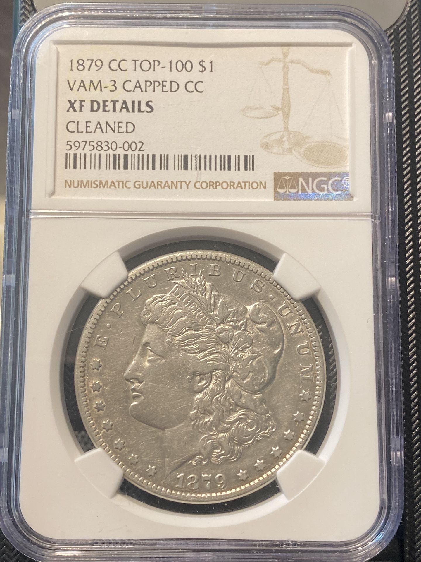 Various graded Morgan Silver Dollars