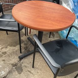 A Round Table 30” Diameter, With 3 Black Chairs, In Good Conditions 