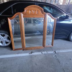 Headboard Design: Three-panel, arched top design with hinged side wings that adjust angles.
