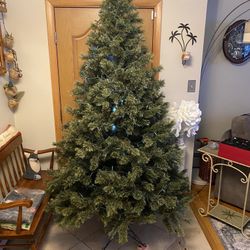 7 ft Christmas tree, deluxe cashmere pine. Add your own lights.  Good condition. 3 piece assembly. 