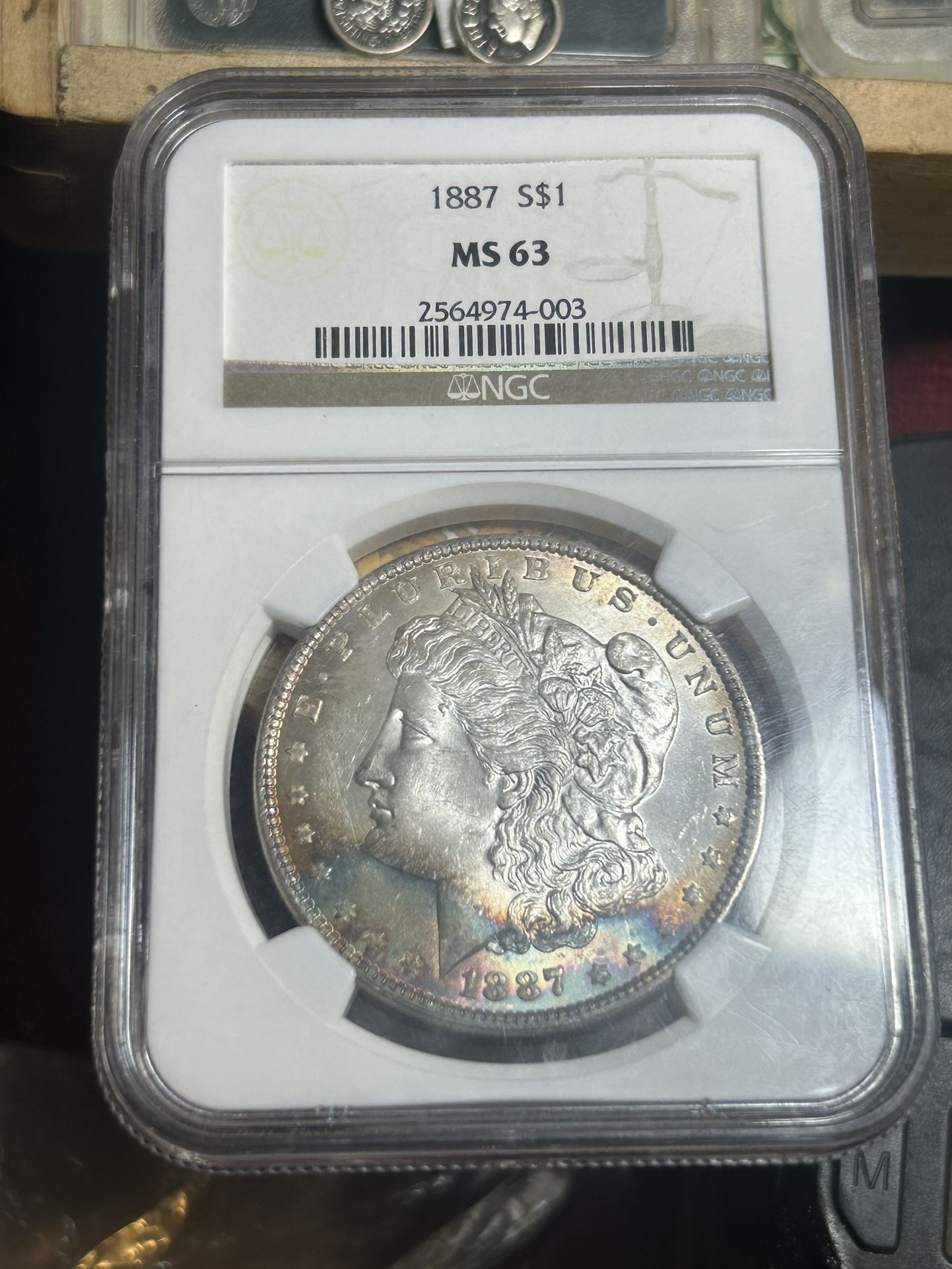 Morgan Silver Dollar 1887 – MS 63 silver Morgan Dollar with full spectr spectrum