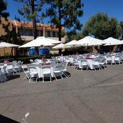 Umbrella sets includes tables, umbrella, plastic folding chairs and linens  R. E. N.     T. A.    L.