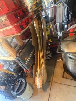 Tiki torches with fuel and cans