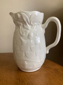 White Ceramic Pitcher with Embossed Floral Design