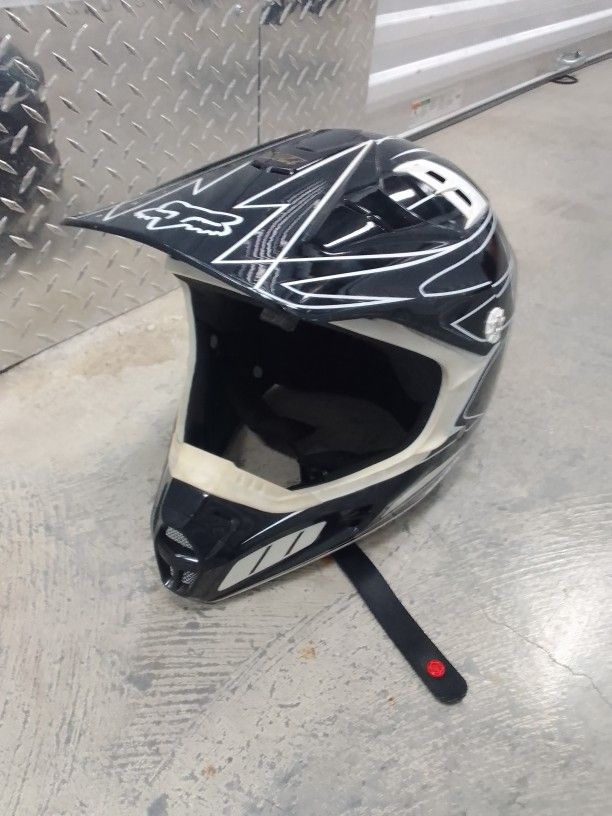 Two Motorcycle Helmets and Boots