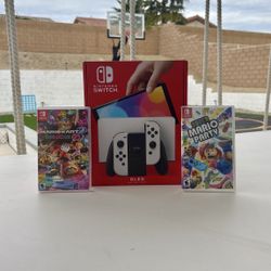 Nintendo Switch Oled With Super Mario Party And Mario Kart Deluxe 8
