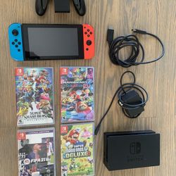 Nintendo Switch With 4 Games, HDMI, Power Cord, Controller Grip