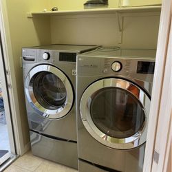 LG Stainless Steel Washer and Dryer Set with pedalstals and WiFi